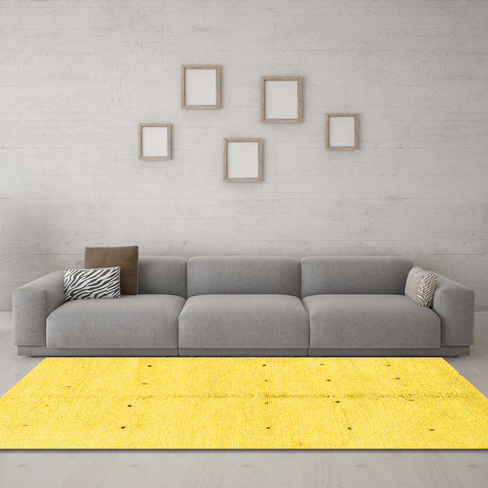 Machine Washable Solid Yellow Modern Rug in a Living Room, wshabs1332yw