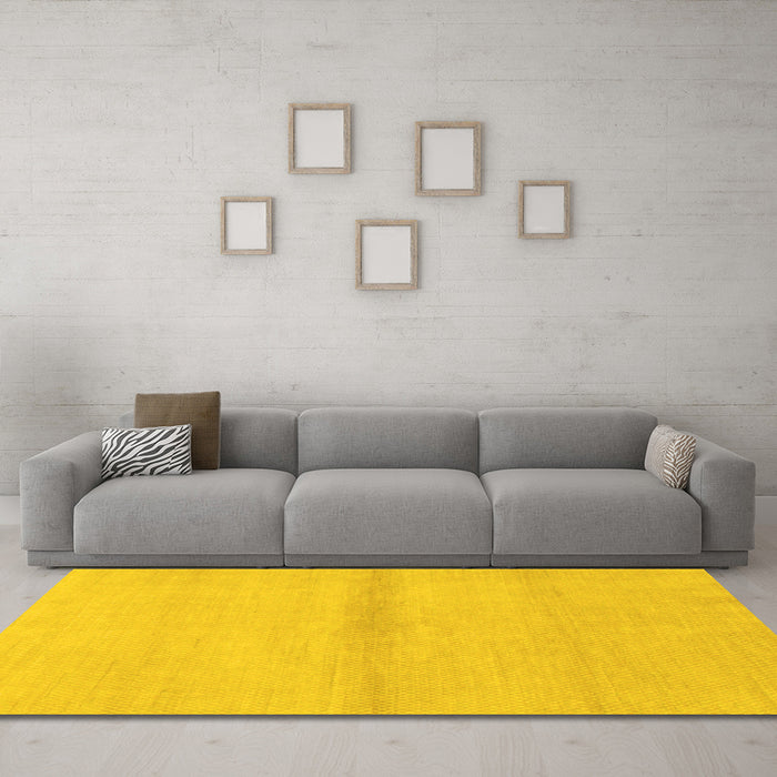 Machine Washable Solid Yellow Modern Rug in a Living Room, wshabs1344yw