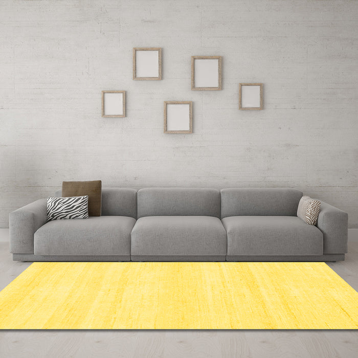 Machine Washable Solid Yellow Modern Rug in a Living Room, wshabs1354yw