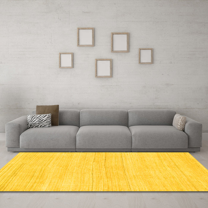 Machine Washable Solid Yellow Modern Rug in a Living Room, wshabs136yw