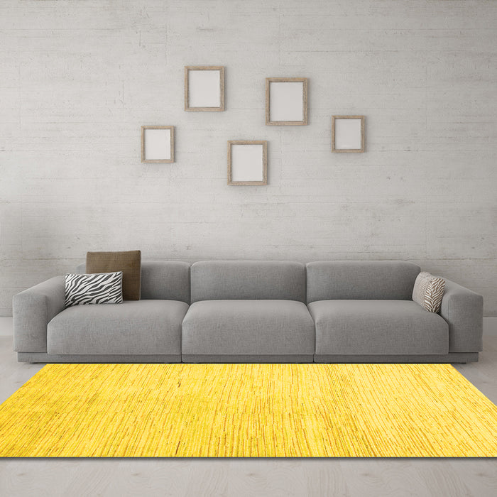 Machine Washable Solid Yellow Modern Rug in a Living Room, wshabs1389yw