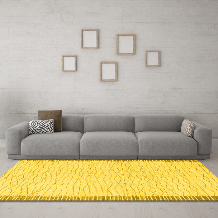 Machine Washable Solid Yellow Modern Rug in a Living Room, wshabs1403yw