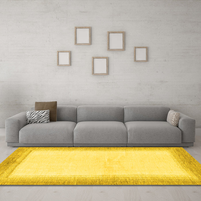Machine Washable Solid Yellow Modern Rug in a Living Room, wshabs1407yw
