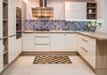 Abstract Red Brown Checkered Rug in a Kitchen, abs1416