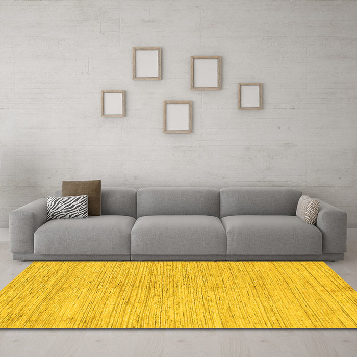 Machine Washable Solid Yellow Modern Rug in a Living Room, wshabs1417yw