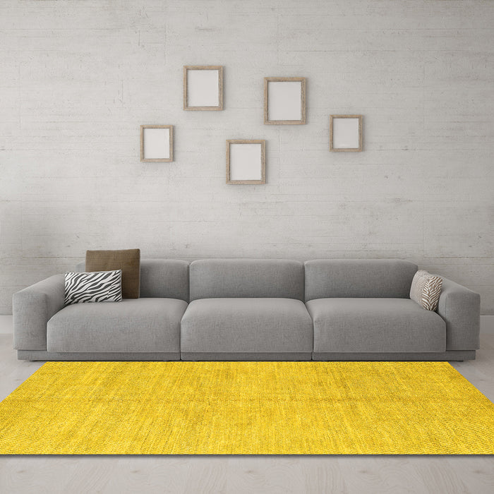 Machine Washable Solid Yellow Modern Rug in a Living Room, wshabs1425yw