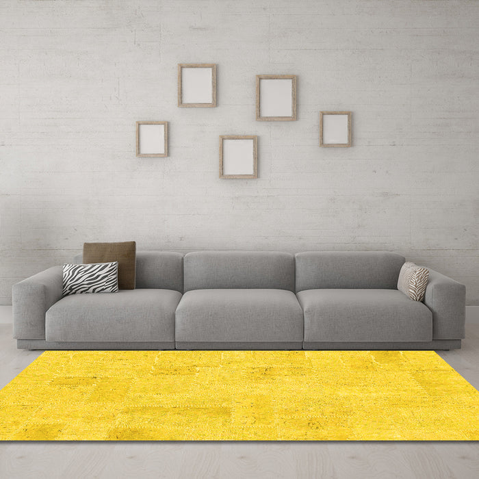 Machine Washable Solid Yellow Modern Rug in a Living Room, wshabs1428yw