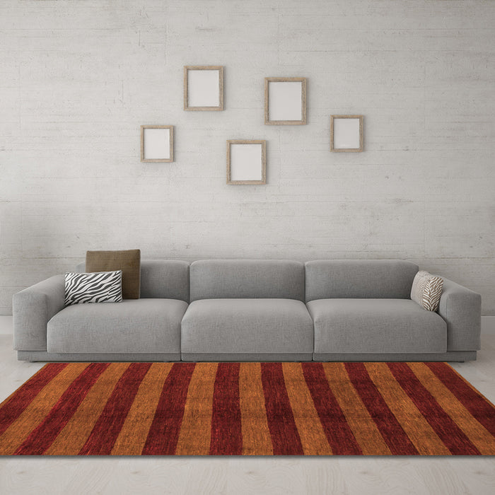 Machine Washable Abstract Orange Modern Area Rugs in a Living Room, wshabs1434org