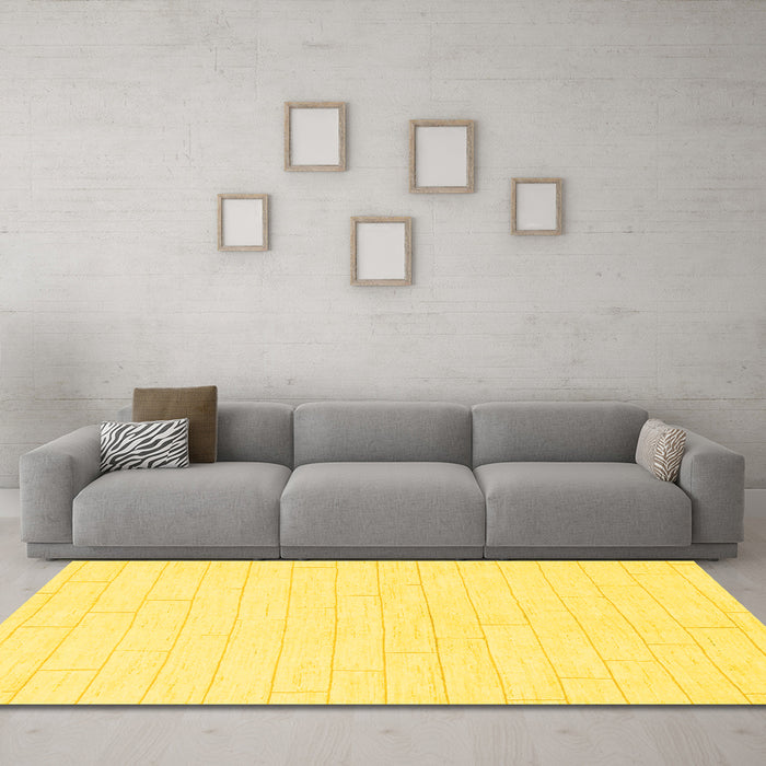 Machine Washable Solid Yellow Modern Rug in a Living Room, wshabs1456yw