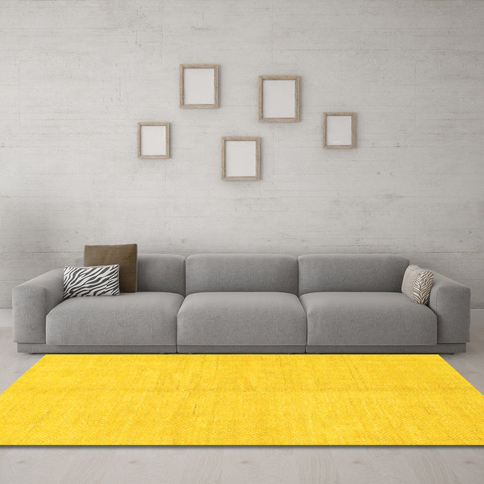 Machine Washable Solid Yellow Modern Rug in a Living Room, wshabs1493yw