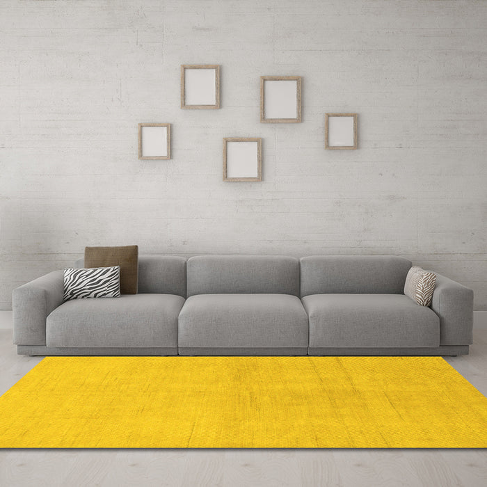 Machine Washable Solid Yellow Modern Rug in a Living Room, wshabs1535yw