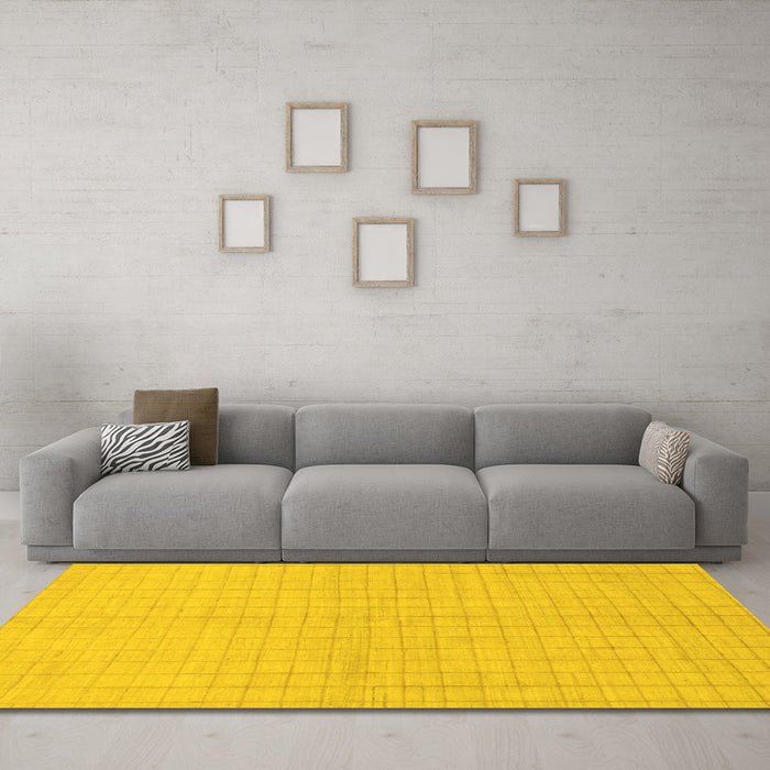 Machine Washable Solid Yellow Modern Rug in a Living Room, wshabs1537yw