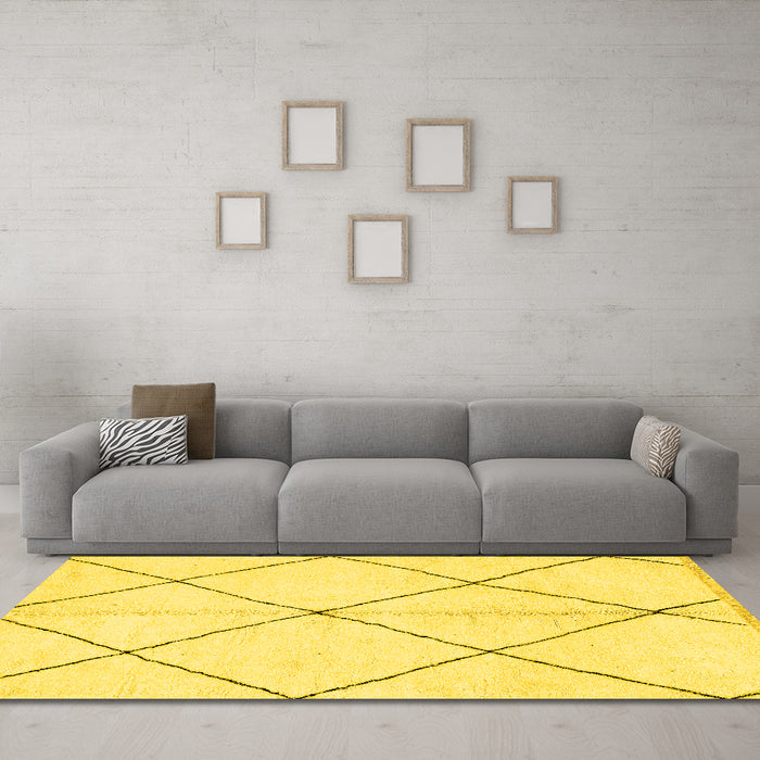 Machine Washable Solid Yellow Modern Rug in a Living Room, wshabs1554yw