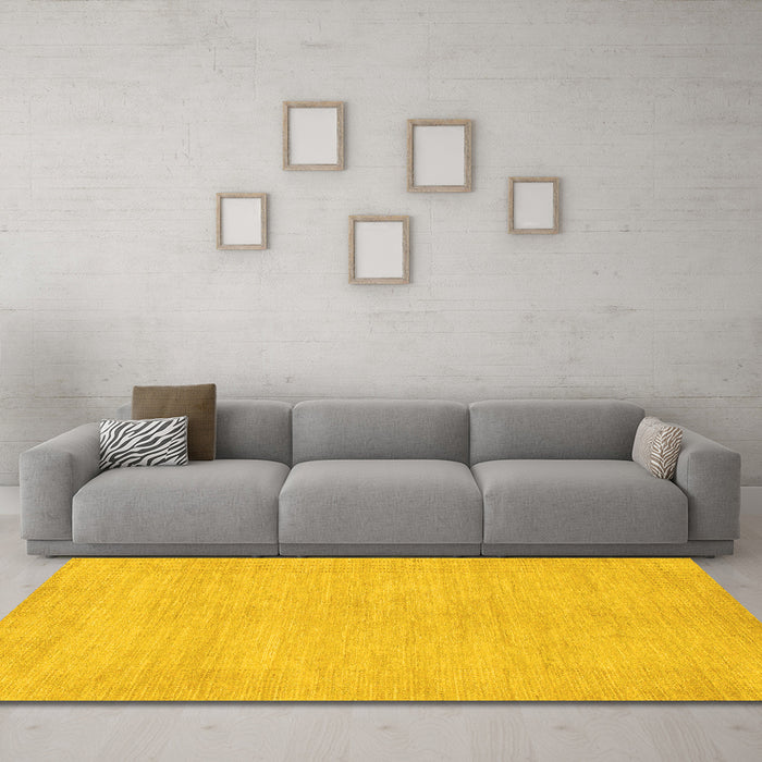 Machine Washable Solid Yellow Modern Rug in a Living Room, wshabs1583yw