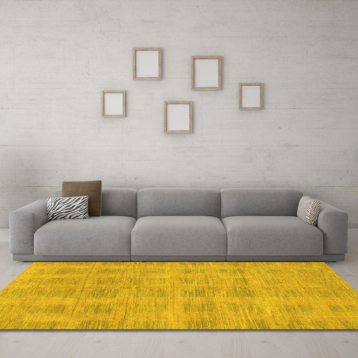 Machine Washable Solid Yellow Modern Rug in a Living Room, wshabs1596yw
