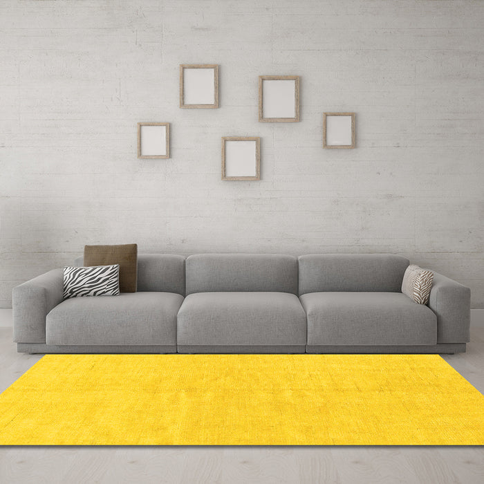 Machine Washable Solid Yellow Modern Rug in a Living Room, wshabs1597yw