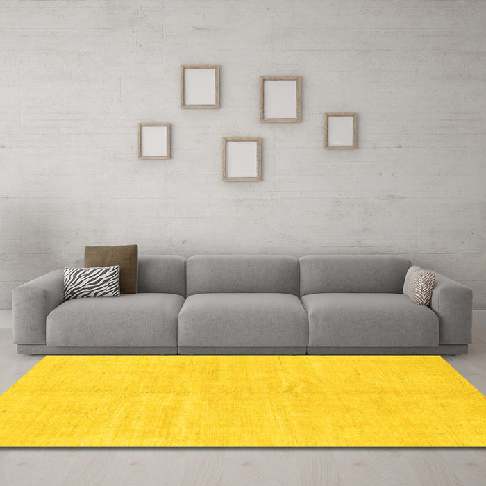 Machine Washable Solid Yellow Modern Rug in a Living Room, wshabs1599yw