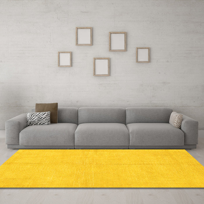 Machine Washable Solid Yellow Modern Rug in a Living Room, wshabs1601yw