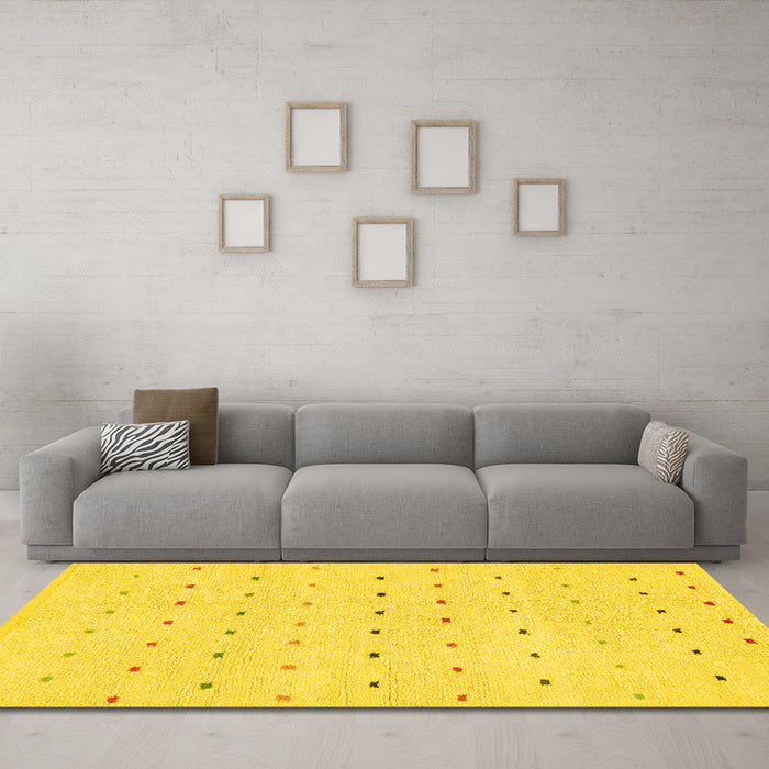 Machine Washable Solid Yellow Modern Rug in a Living Room, wshabs1796yw