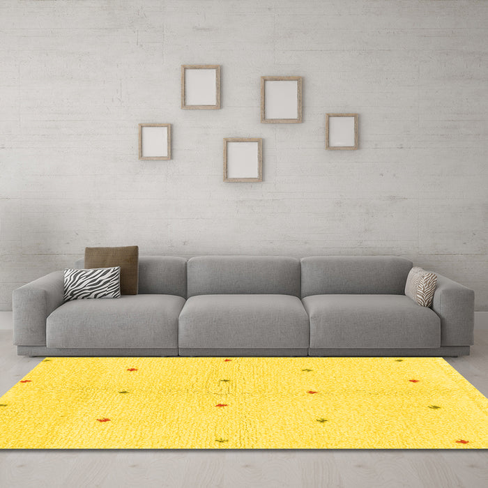 Machine Washable Solid Yellow Modern Rug in a Living Room, wshabs1804yw