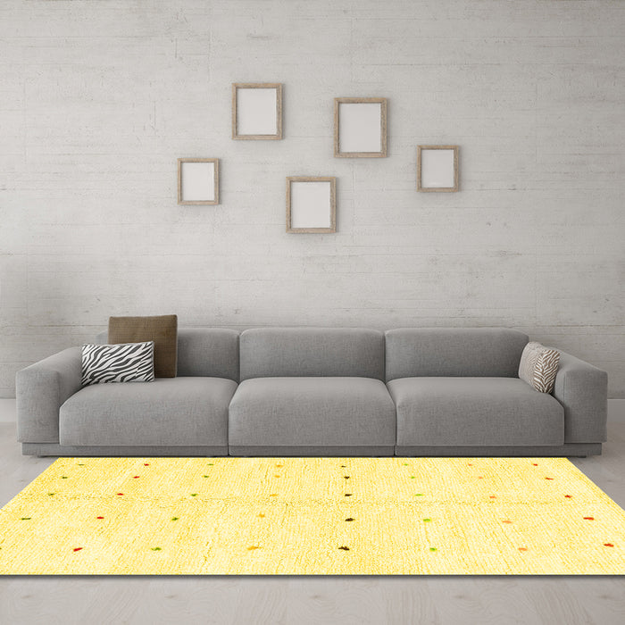 Machine Washable Solid Yellow Modern Rug in a Living Room, wshabs1809yw