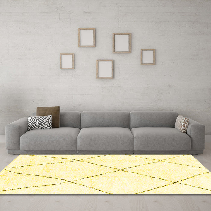 Machine Washable Solid Yellow Modern Rug in a Living Room, wshabs1849yw