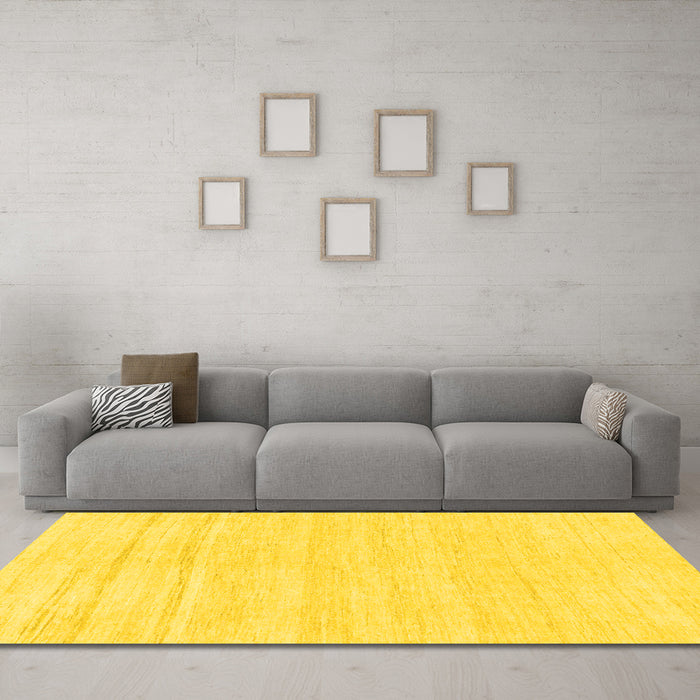 Machine Washable Solid Yellow Modern Rug in a Living Room, wshabs1851yw