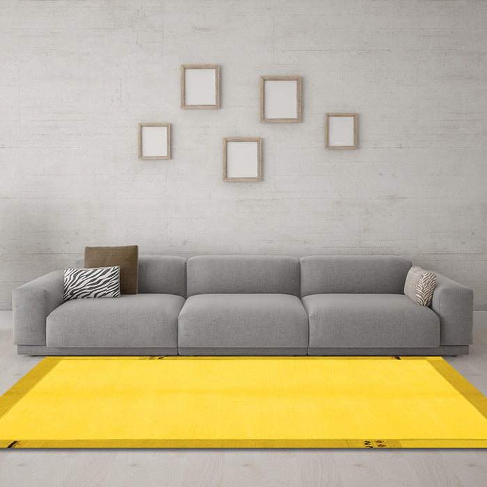 Machine Washable Solid Yellow Modern Rug in a Living Room, wshabs1870yw