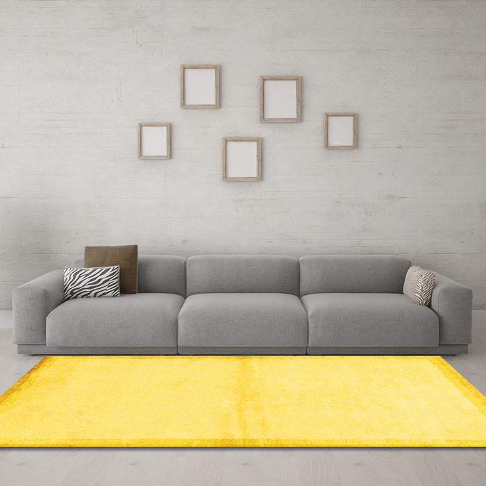 Machine Washable Solid Yellow Modern Rug in a Living Room, wshabs1910yw