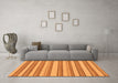 Machine Washable Solid Orange Modern Area Rugs in a Living Room, wshabs197org