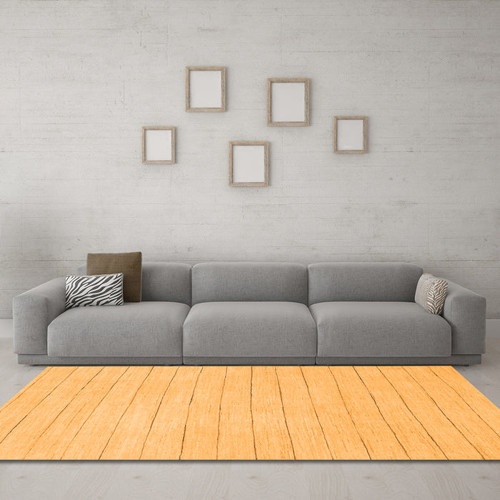 Machine Washable Solid Orange Modern Area Rugs in a Living Room, wshabs2458org