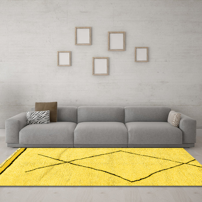 Machine Washable Solid Yellow Modern Rug in a Living Room, wshabs2897yw