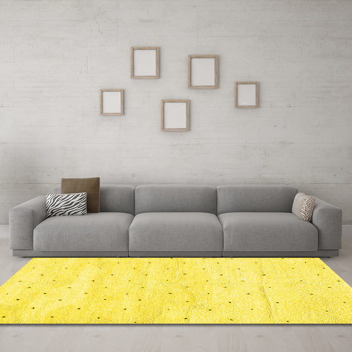 Machine Washable Solid Yellow Modern Rug in a Living Room, wshabs2902yw