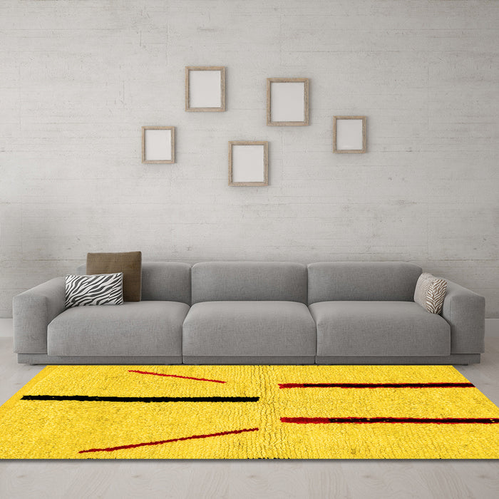 Machine Washable Solid Yellow Modern Rug in a Living Room, wshabs2906yw