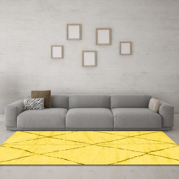 Machine Washable Solid Yellow Modern Rug in a Living Room, wshabs2916yw