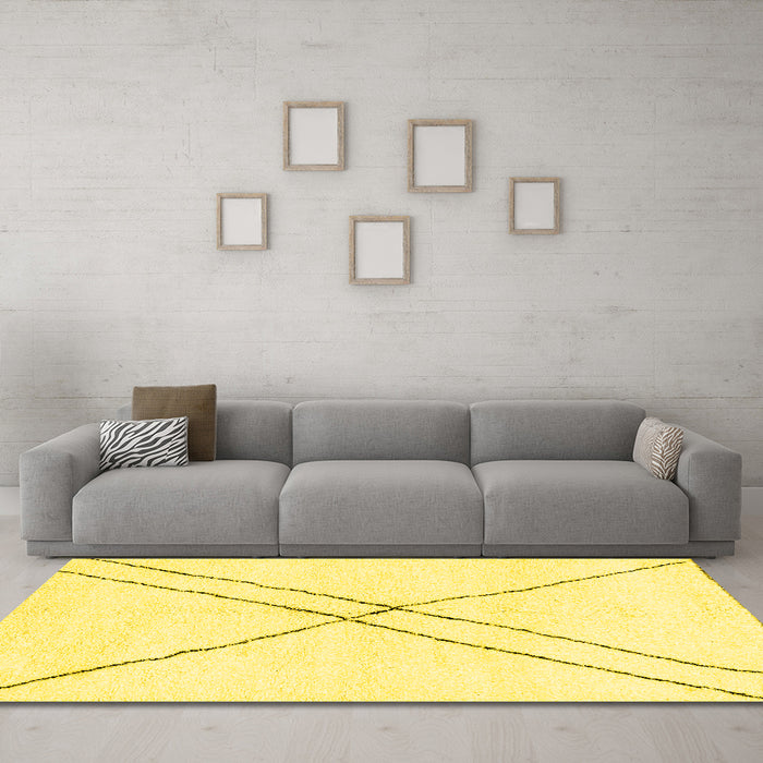 Machine Washable Solid Yellow Modern Rug in a Living Room, wshabs2937yw