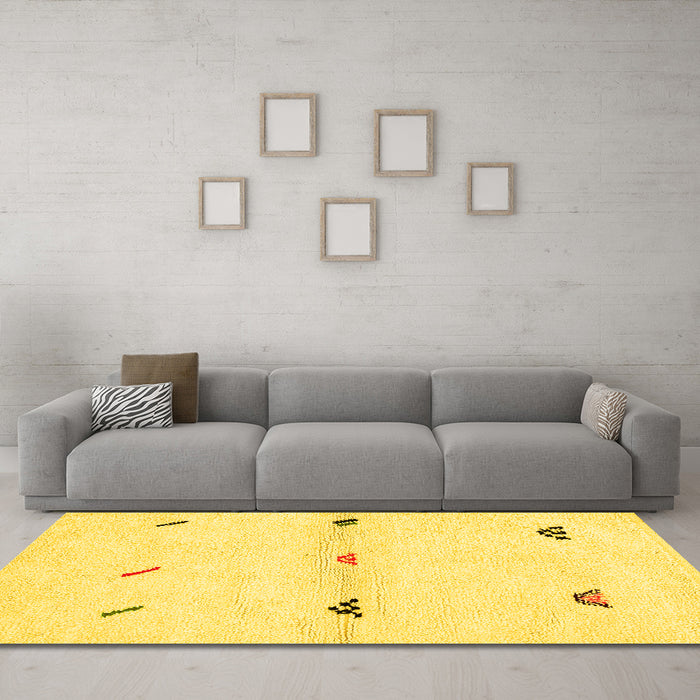 Machine Washable Solid Yellow Modern Rug in a Living Room, wshabs2941yw