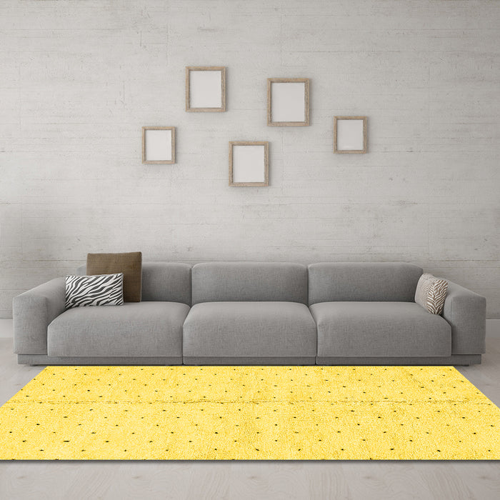 Machine Washable Solid Yellow Modern Rug in a Living Room, wshabs2947yw