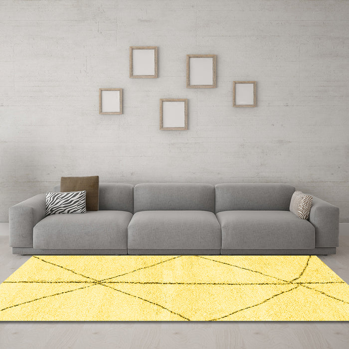 Machine Washable Solid Yellow Modern Rug in a Living Room, wshabs2952yw