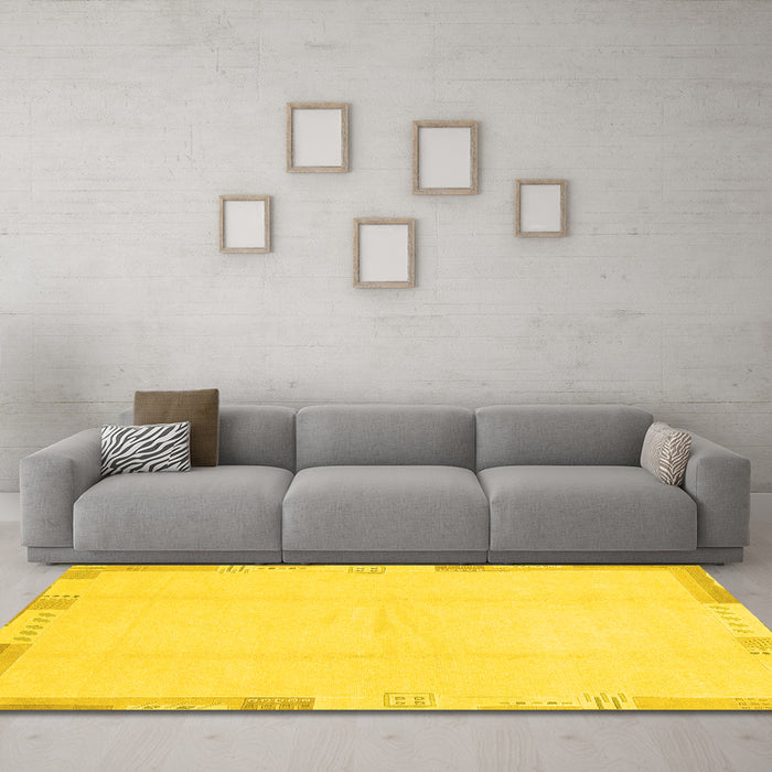Machine Washable Solid Yellow Modern Rug in a Living Room, wshabs3003yw