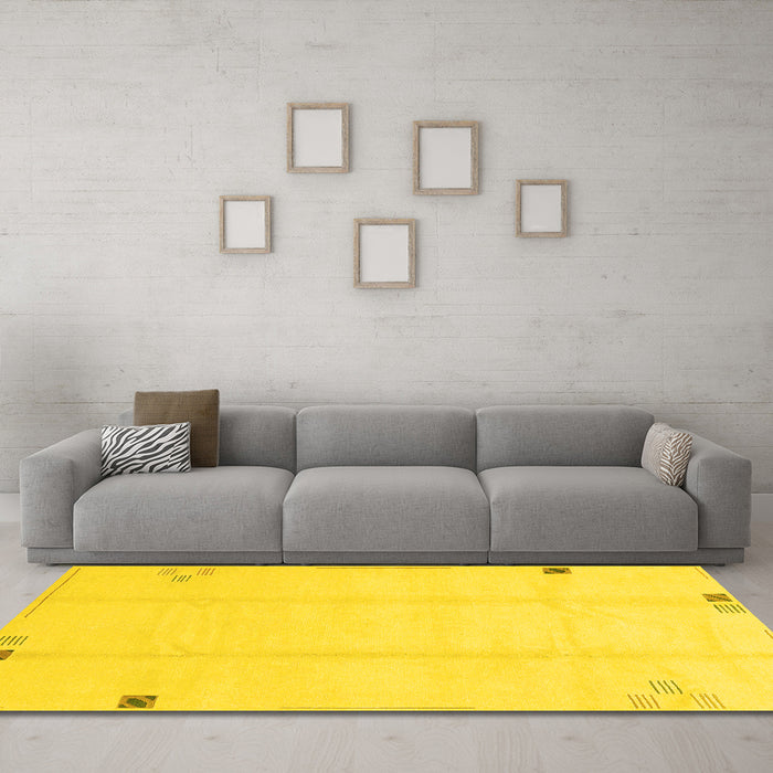 Machine Washable Solid Yellow Modern Rug in a Living Room, wshabs3437yw