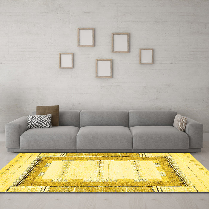 Machine Washable Solid Yellow Modern Rug in a Living Room, wshabs397yw