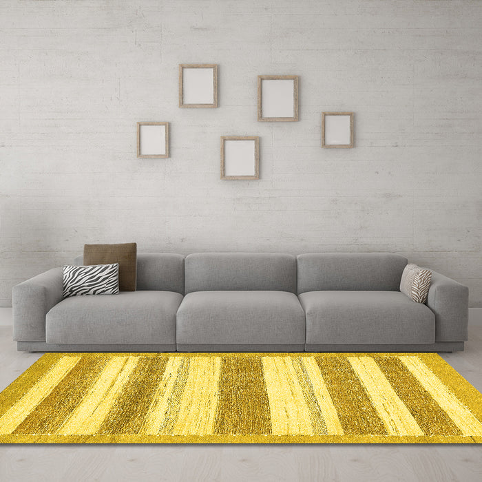 Machine Washable Solid Yellow Modern Rug in a Living Room, wshabs405yw