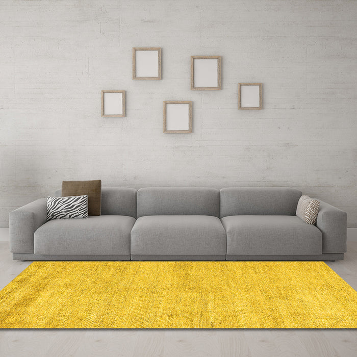 Machine Washable Solid Yellow Modern Rug in a Living Room, wshabs4115yw