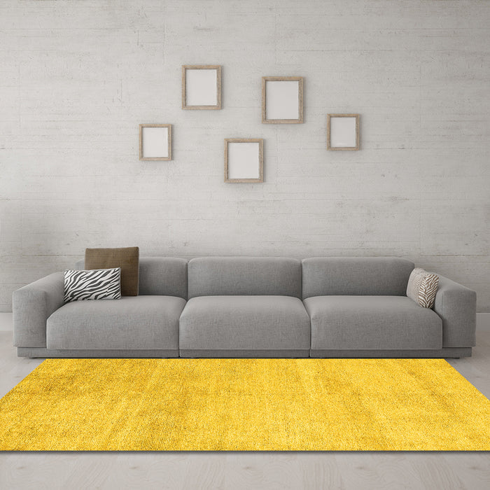 Machine Washable Solid Yellow Modern Rug in a Living Room, wshabs4123yw