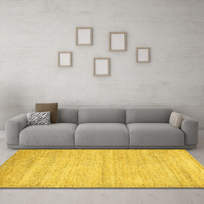 Machine Washable Solid Yellow Modern Rug in a Living Room, wshabs4291yw