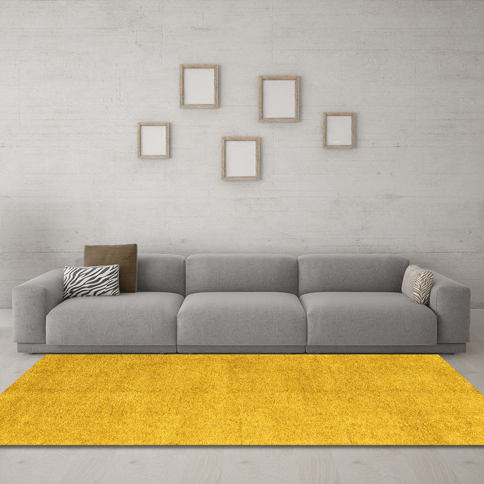 Machine Washable Solid Yellow Modern Rug in a Living Room, wshabs4301yw