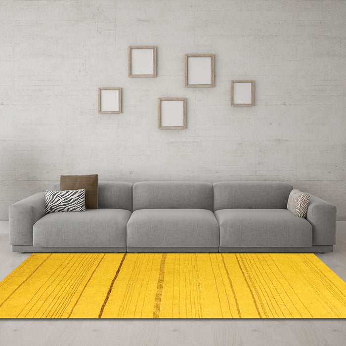 Machine Washable Solid Yellow Modern Rug in a Living Room, wshabs4669yw