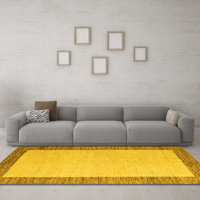 Machine Washable Solid Yellow Modern Rug in a Living Room, wshabs4685yw