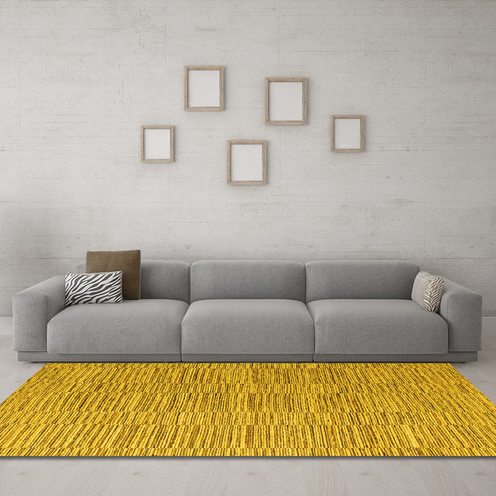 Machine Washable Solid Yellow Modern Rug in a Living Room, wshabs4704yw